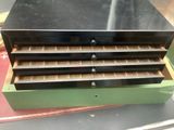 an image of a stack of drawers sitting on top of a table
