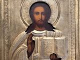 une image représentant un tableau où l'on voit Jésus tenant un livre entre ses mains