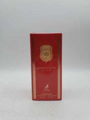 a red box with a gold emblem on it sitting on a white surface