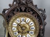 a clock that has roman numerals on the face of it