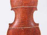 an old violin on a stand against a white background