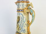 a blue and yellow vase with a dragon on it