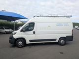a white van that is parked in a parking lot