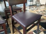 two chairs that are sitting on a tiled floor