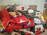 a box full of boxes of food that are sitting on the floor