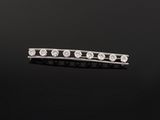 a diamond bar broocher, by cartier