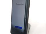 a phone that is sitting on top of a stand