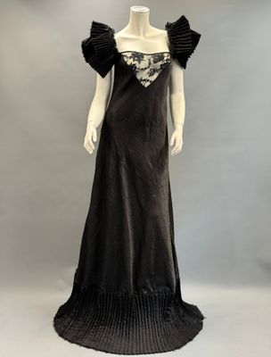 an image of a mannequin wearing a black evening dress