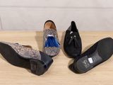 three pairs of women ' s shoes on a table with a blue tassel