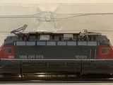 a black and red train in a clear case