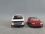two toy cars that are sitting next to each other