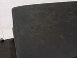 a piece of luggage sitting on top of a black suitcase