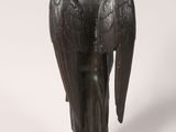 an image of a statue of an angel with a bird on it ' s back