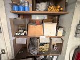 a small room with a lot of items on the shelves