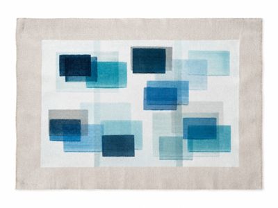 a white and blue rug with squares on it