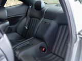 the interior of a car with black leather seats and a steering wheel