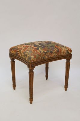 an image of a foot stool with a floral upholstered seat