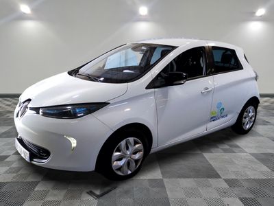 an image of a white electric car on a checkered floor