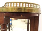 a wooden table with a mirror on top of it