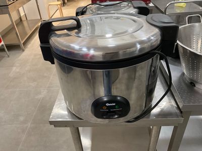 a large pot sitting on top of a table in a kitchen
