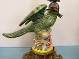 a bird that is sitting on top of a vase
