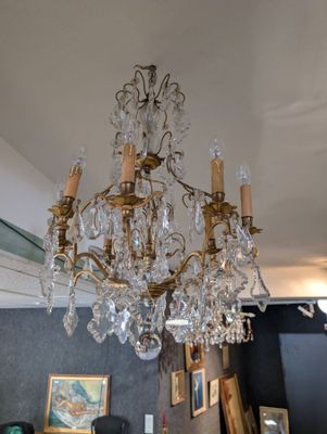 a chandelier hanging from the ceiling in a room