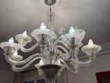 a chandelier that is hanging from the ceiling in a room