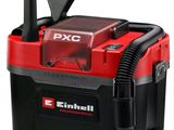 an image of a red and black vacuum cleaner with a black hose