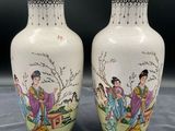 pair of chinese vases decorated with ladies and flowers on a table