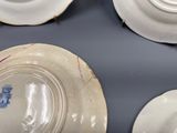 four plates that are sitting on a table