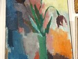 un tableau de fleurs dans un vase sur le mur