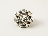 a close up of a ring with a flower design on it