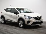 a white car parked in a room with a checkered floor