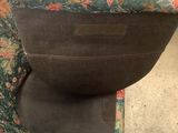 a chair that has a seat that has a flower pattern on it