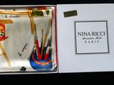 a box with a tie and a pen holder inside of it