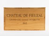 wooden box with a sign that reads chateau de feuzal grand cru classe de graves 2012