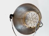 a metal colander with a strainer attached to it