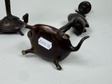 three figurines of animals that are sitting on a table