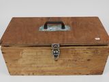 an old wooden box with a metal latch on the top