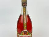 an image of a bottle of wine that is sitting on a table