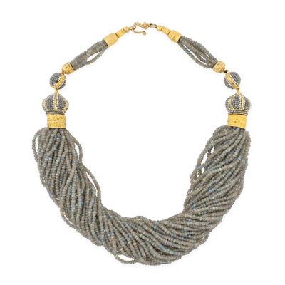 a close up of a necklace on a white background