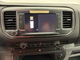 a picture of a car dashboard with a bottle of water in it