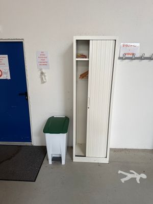 a blue door and a white cabinet in a room