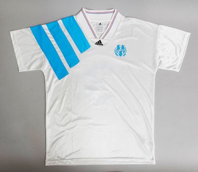 the shirt is white with blue stripes on it