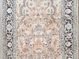 an antique persian rug with a floral design and fringe fringes