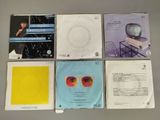six cd ' s of various types of music are arranged on a table