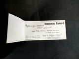 an envelope with a handwritten message on it sitting on a table