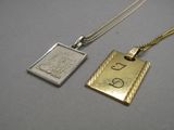 two gold and silver necklaces with a silver pendant on a chain
