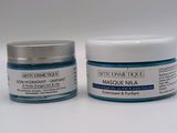 a close up of two jars of creams on a white surface