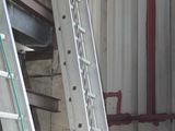 many ladders that are sitting in a building